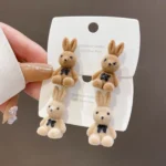 cuterabbitearringskoreanstylecartoonplushrabbitbowearringsforwomengirls1pairrandomcolor 2 Shopwido Pakistan